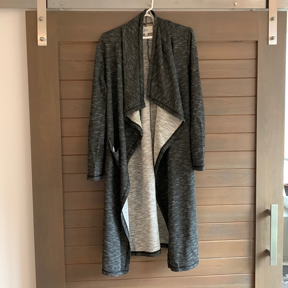 Long, dark grey sweater with dual pockets and fun neck line. Size L